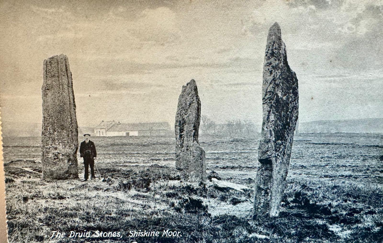 Undated postcard of the Machrie Moor standing stones, Moss Farm in the distance